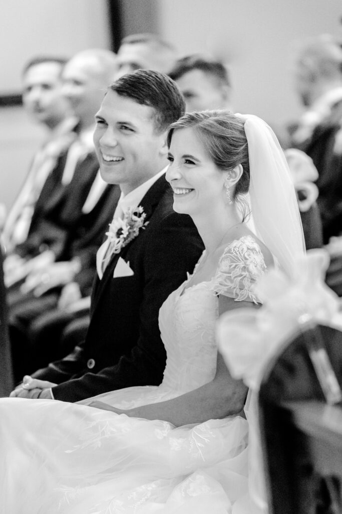 A bride and groom laughing during the ceremony before their Stevenson Ridge reception