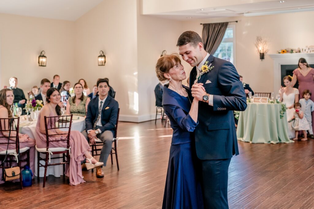 A groom and his mom sharing a dance at his Stevenson Ridge wedding reception