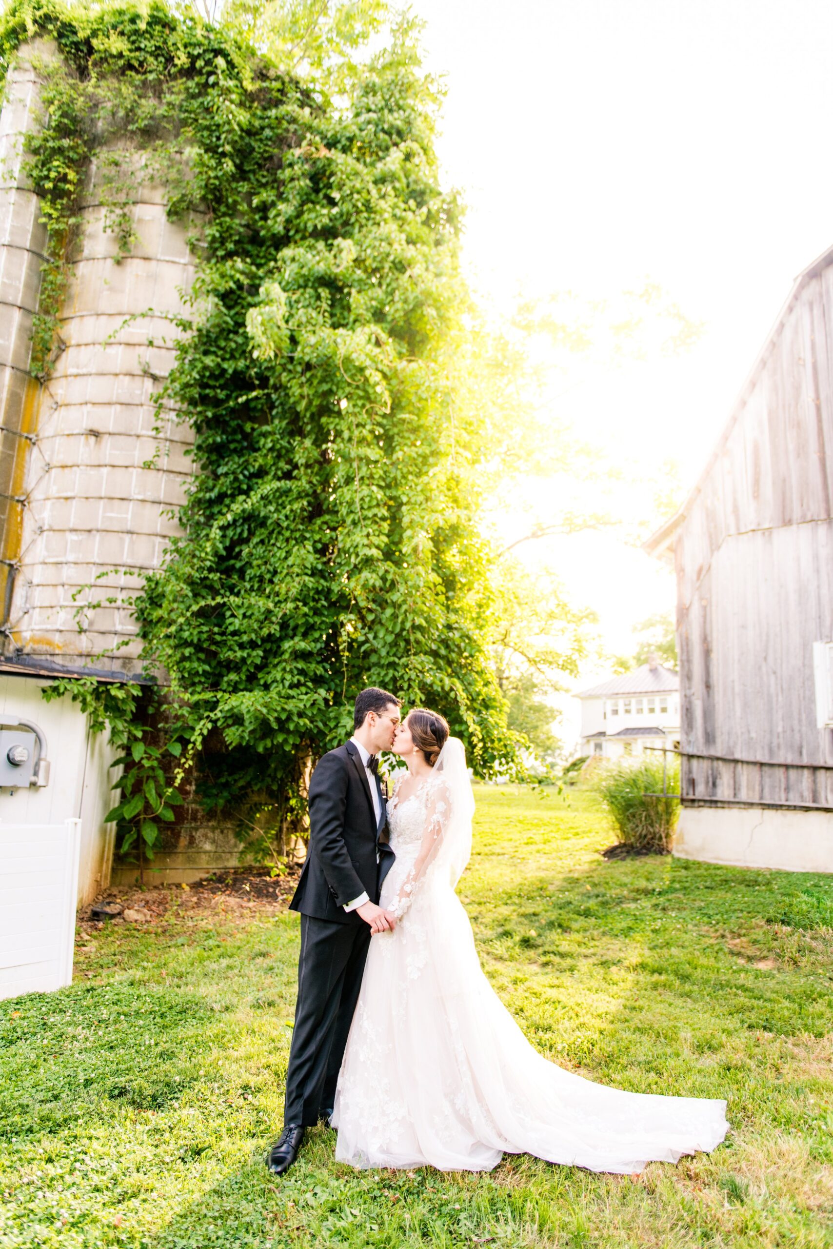 A bride and groom sharing a golden hour portrait at the best wedding venues in Loudoun County - The Barns at Hamilton Station Vineyard