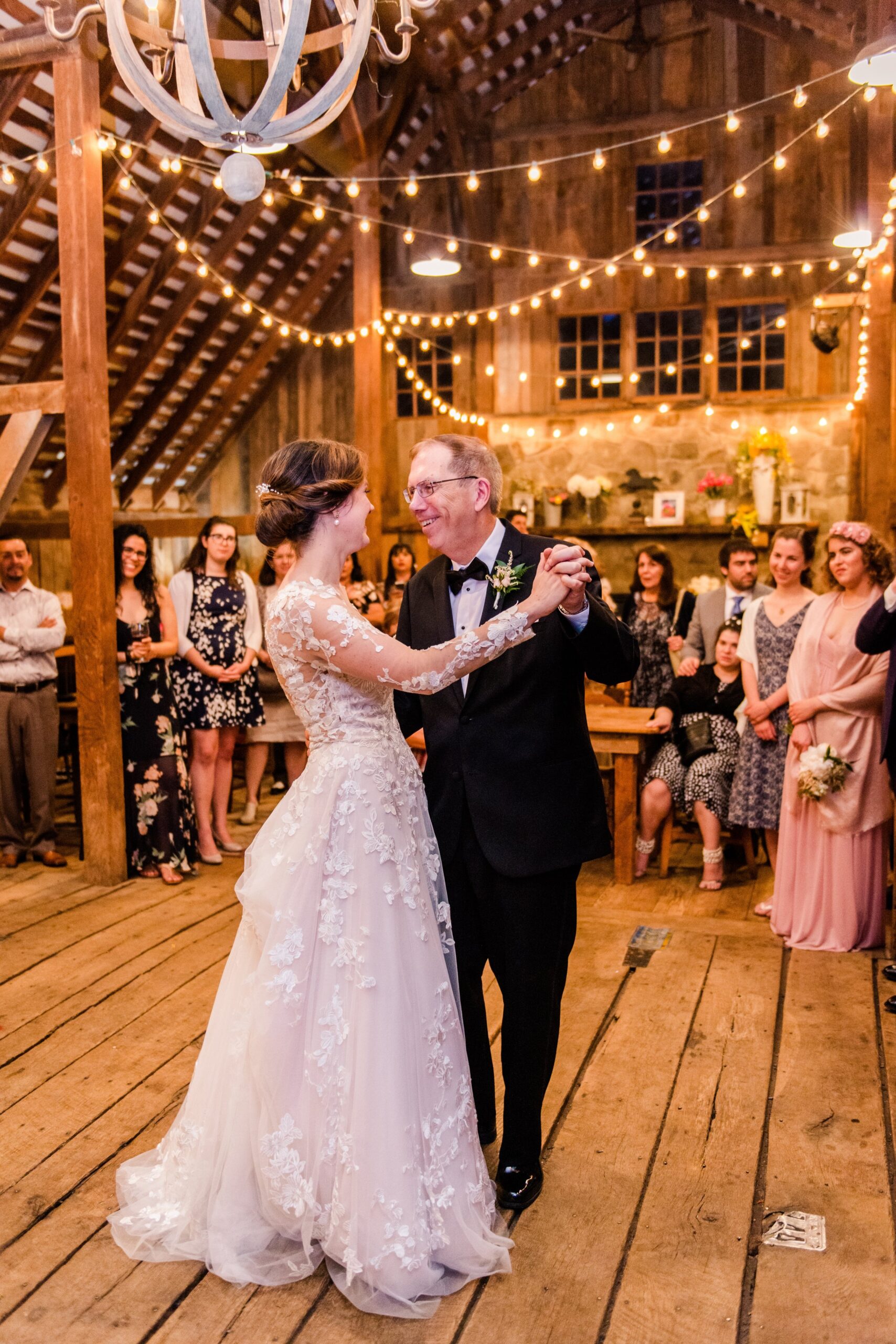A bride and her father sharing a dance at her wedding reception at The Barns at Hamilton Station Vineyard in Loudoun County Virginia