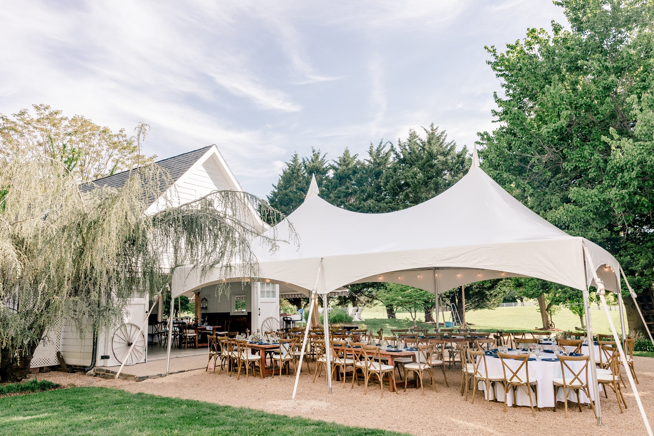 The exterior of the reception space for a wedding at Blue Hill Farm in Loudoun County Virginia