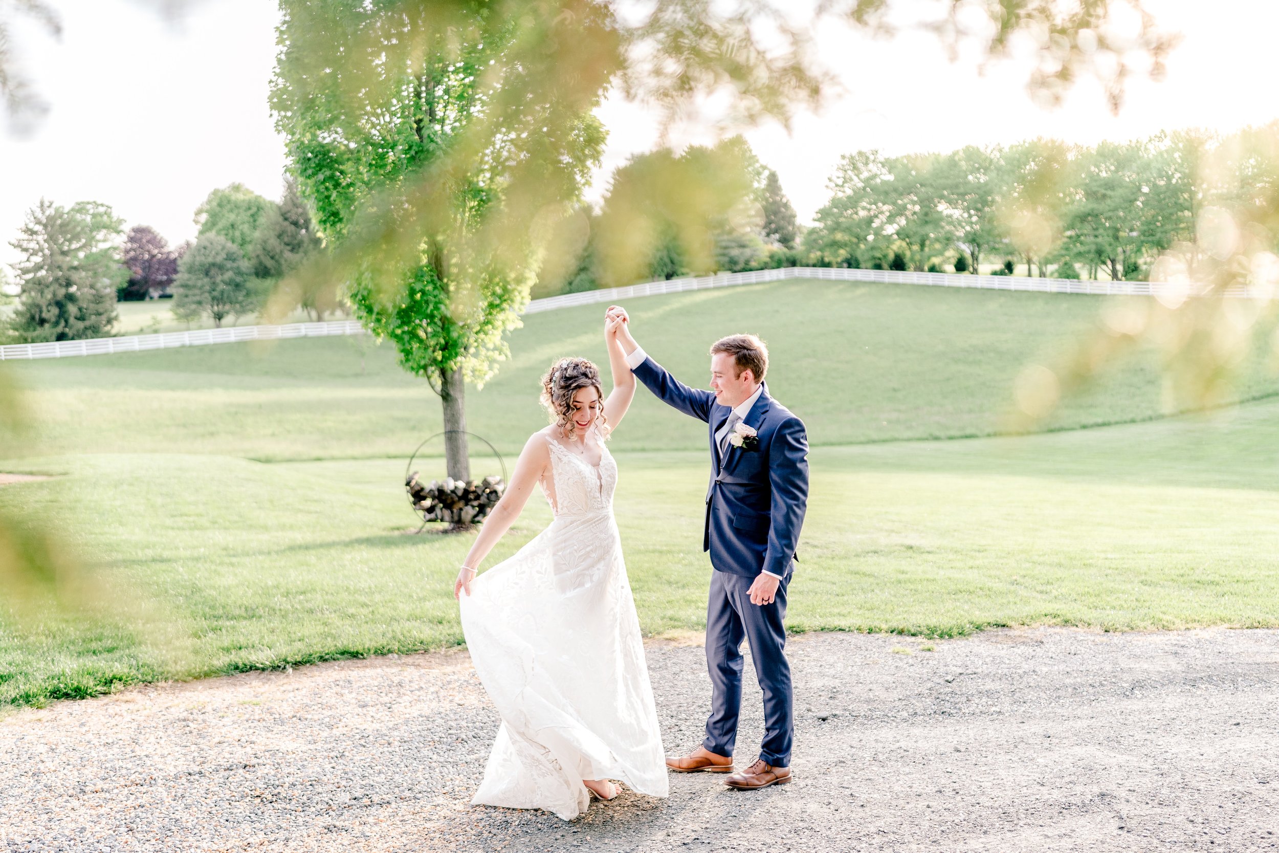 A bride and groom share a dance in golden hour light at one of the best wedding venues in Loudoun County Virginia