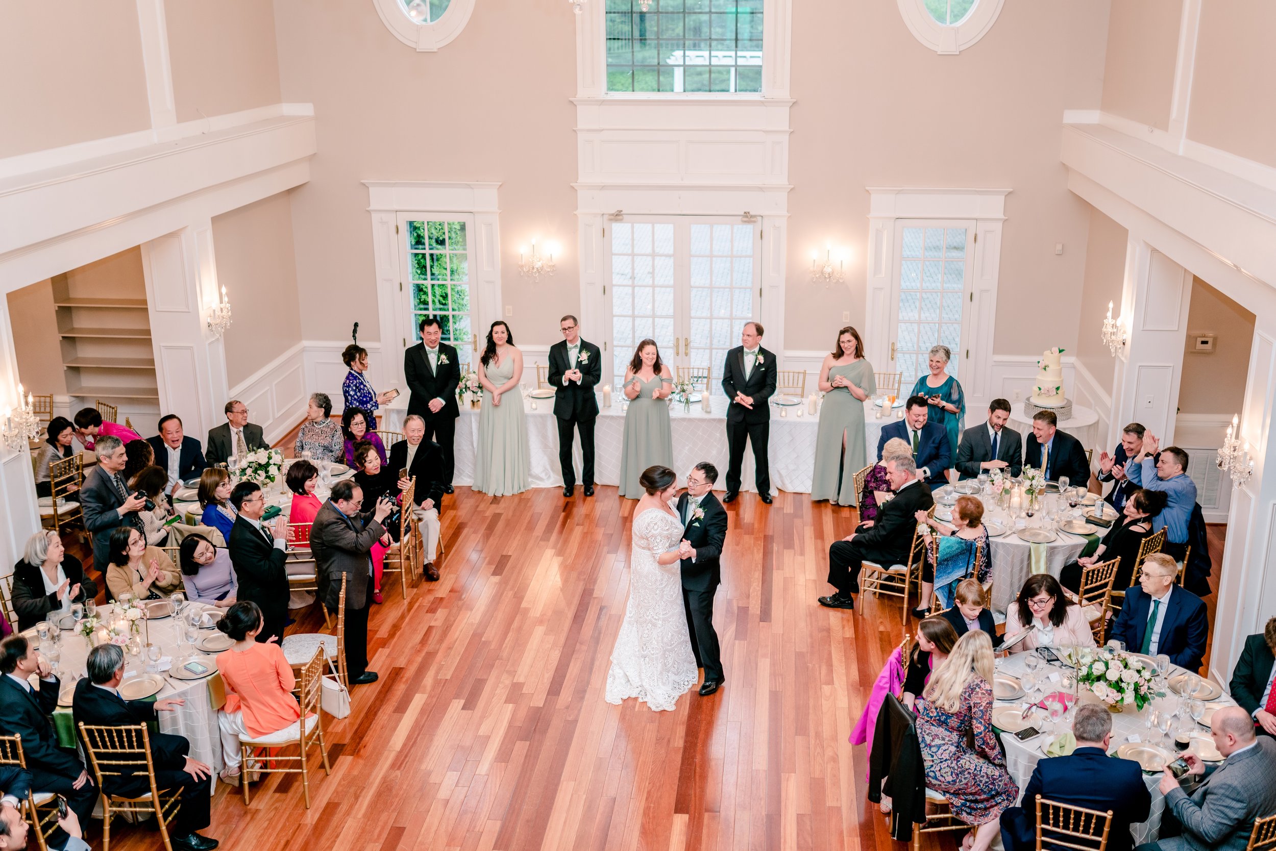 A bride and groom sharing their first dance in the ballroom of one of the best wedding venues in Loudoun County Virginia