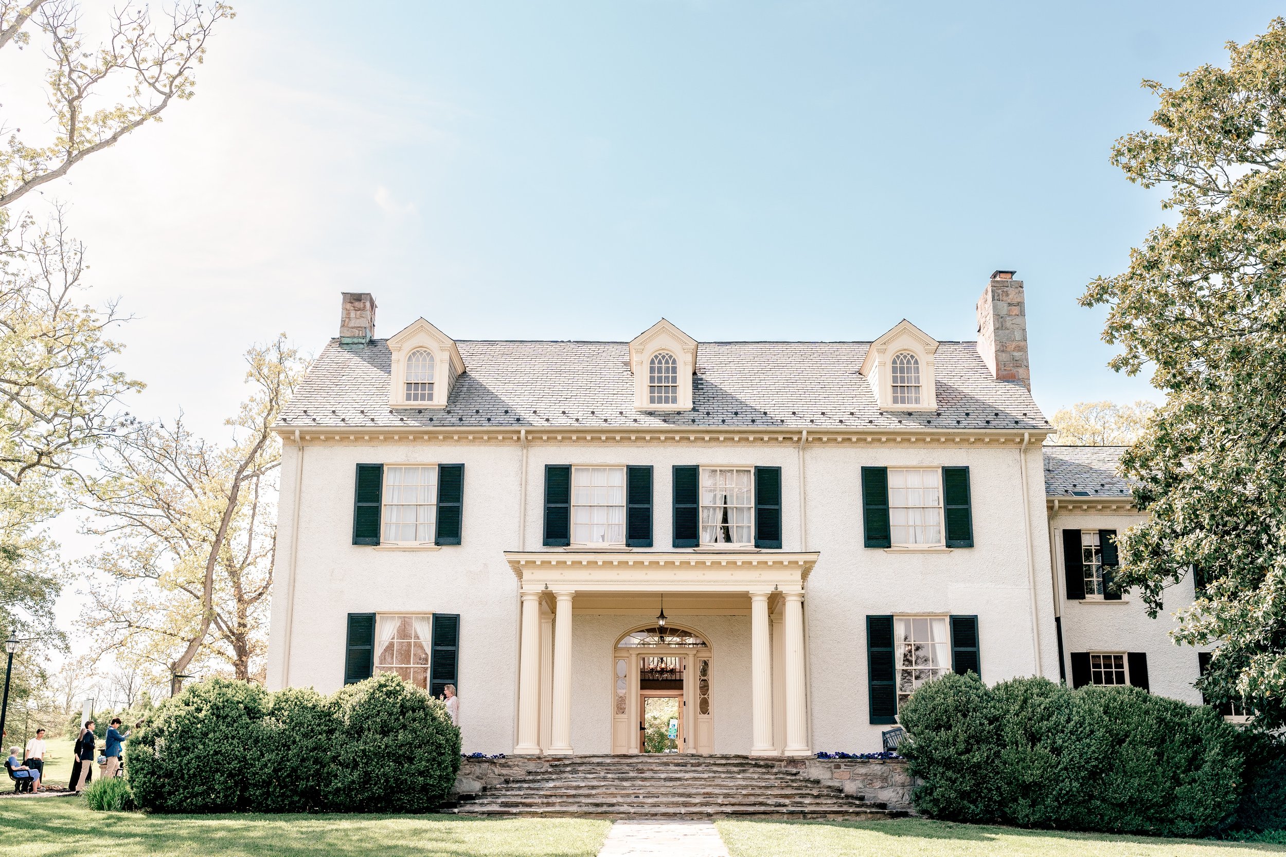The facade of the historic house during a wedding at Rust Manor House in Leesburg Virginia