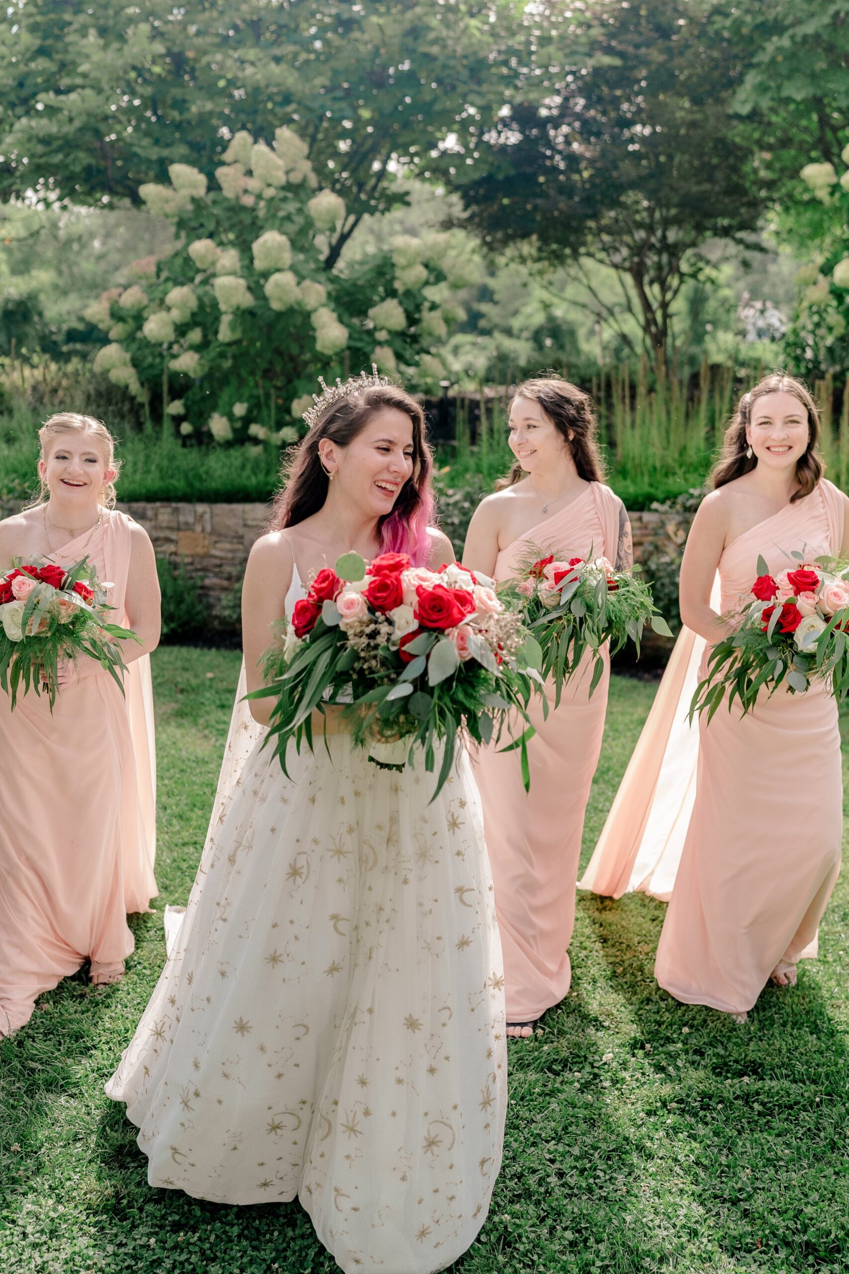 A bridal party walking through the garden of one of the best wedding venues in Loudoun County Virginia