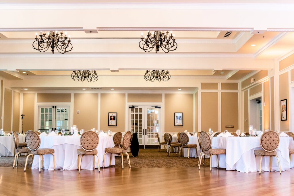 A wide view of the main ballroom for a wedding at the Country Club of Fairfax in Northern Virginia