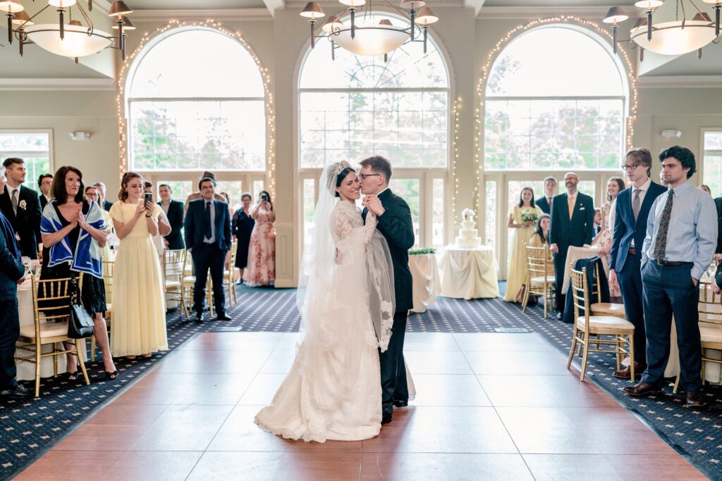 A bride and groom sharing their first dance during their wedding reception at Westfields Golf Club in Clifton Virginia
