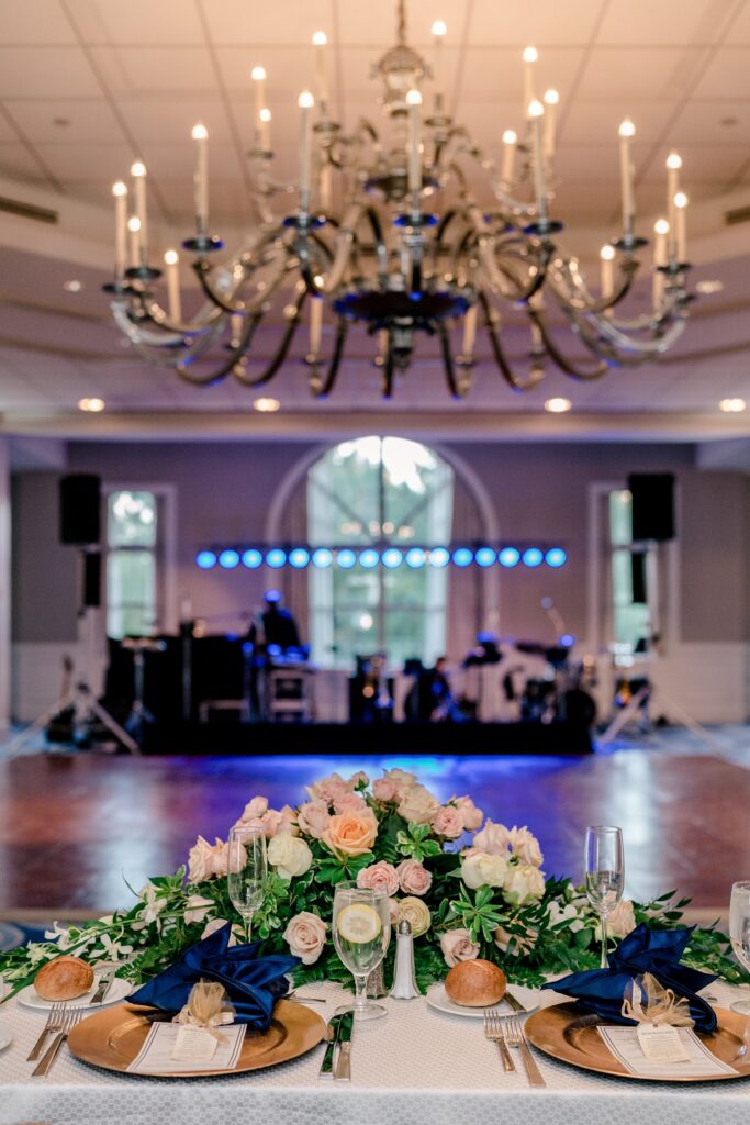 A view of the dance floor with a chandelier overhead at one of the best wedding venues in Fairfax County