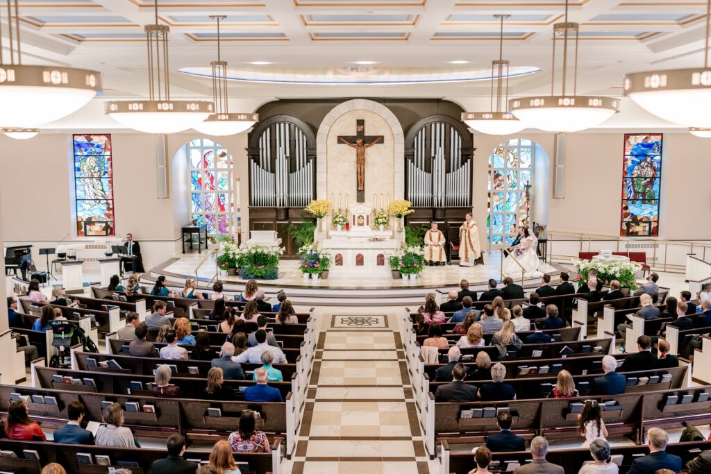 A view from the choir loft of a Catholic wedding at St. Joseph's Church in Cockeysville, MD