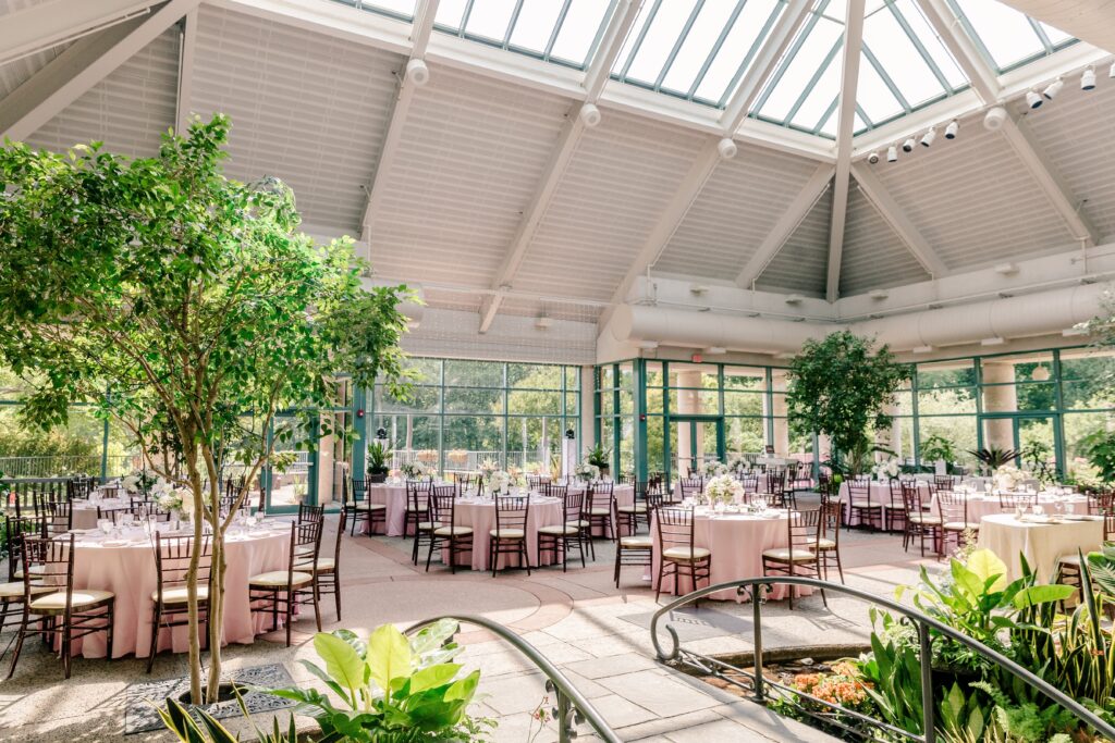 A wide view of a wedding reception at The Atrium at Meadowlark Botanical Gardens