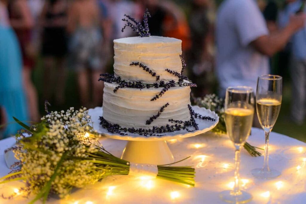 A buttercream wedding cake decorated with lavender
