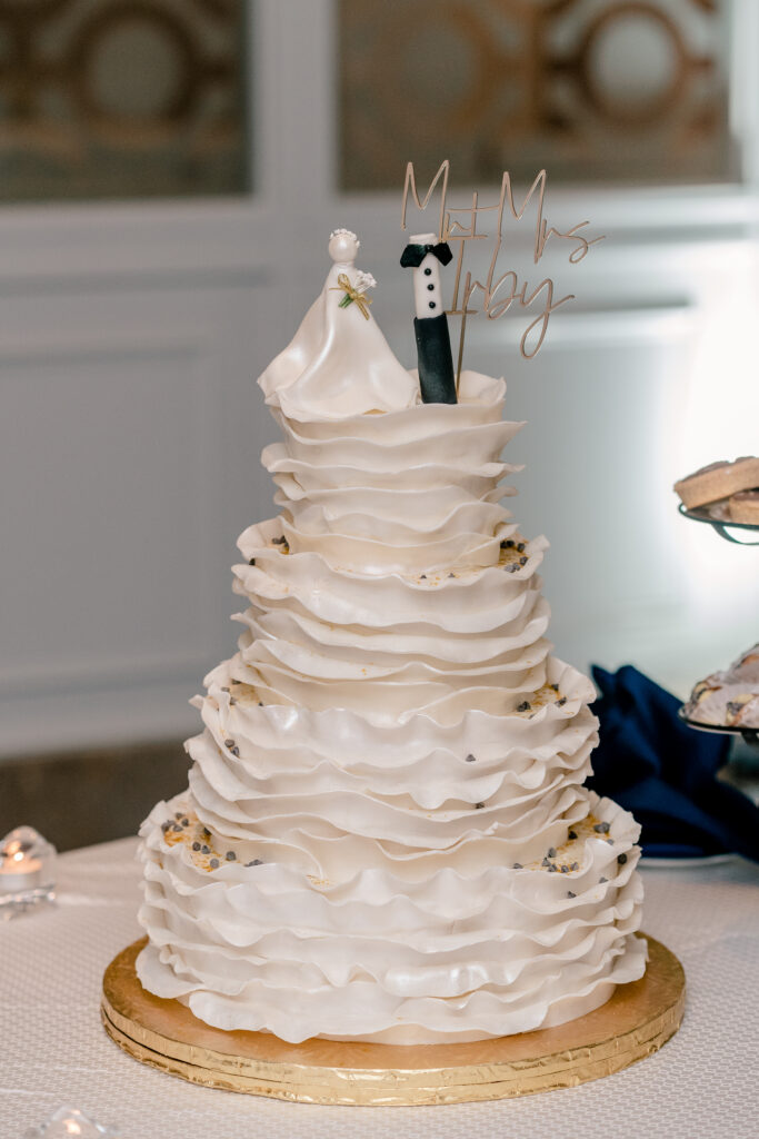A four tier wedding cake with dramatic white ruffles for a Westfields Marriott wedding