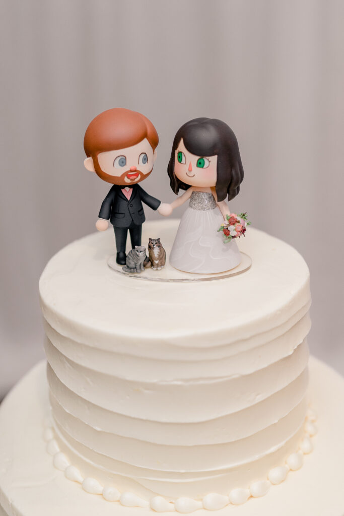A custom Animal Crossing style cake topper for a bride and groom