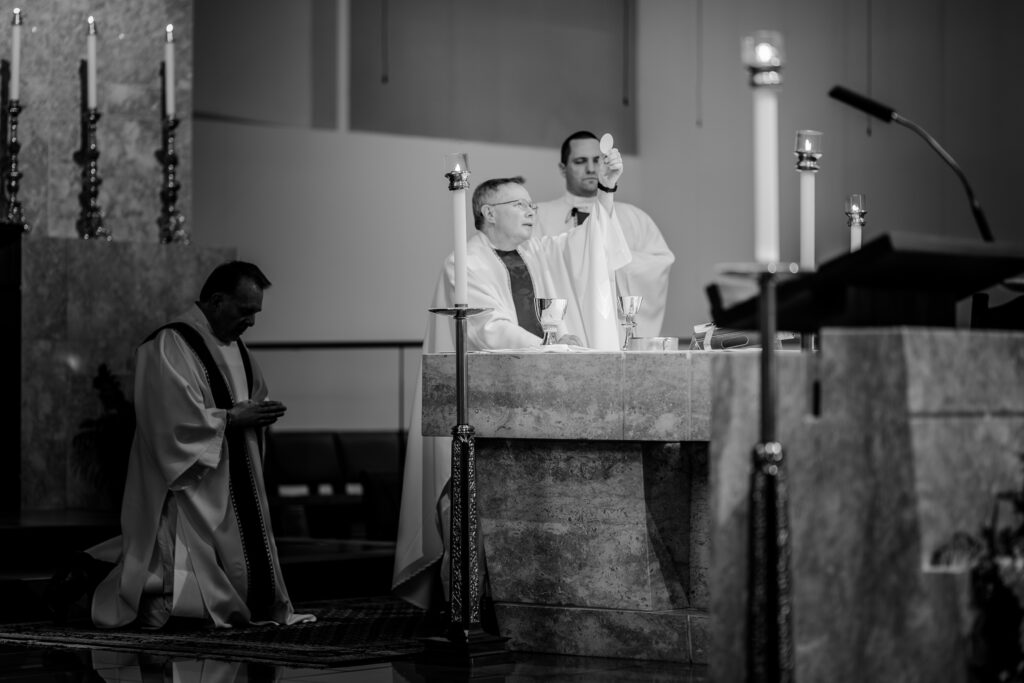 The moment of Consecration during a wedding at St Philip Catholic Church in Falls Church Virginia