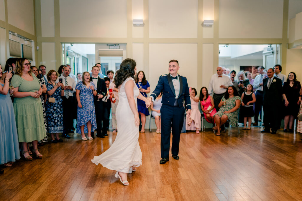 A bride and groom share their first dance during a tented wedding reception at Historic Blenheim in Fairfax, Virginia