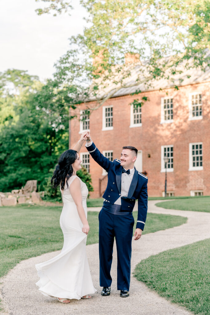 A bride and groom dancing together at golden hour during a tented wedding reception at Historic Blenheim in Fairfax, Virginia