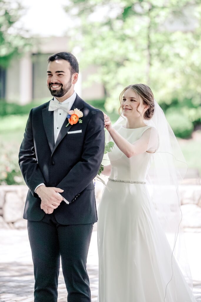 A bride approaching her groom for their first look before their Sheraton Reston wedding