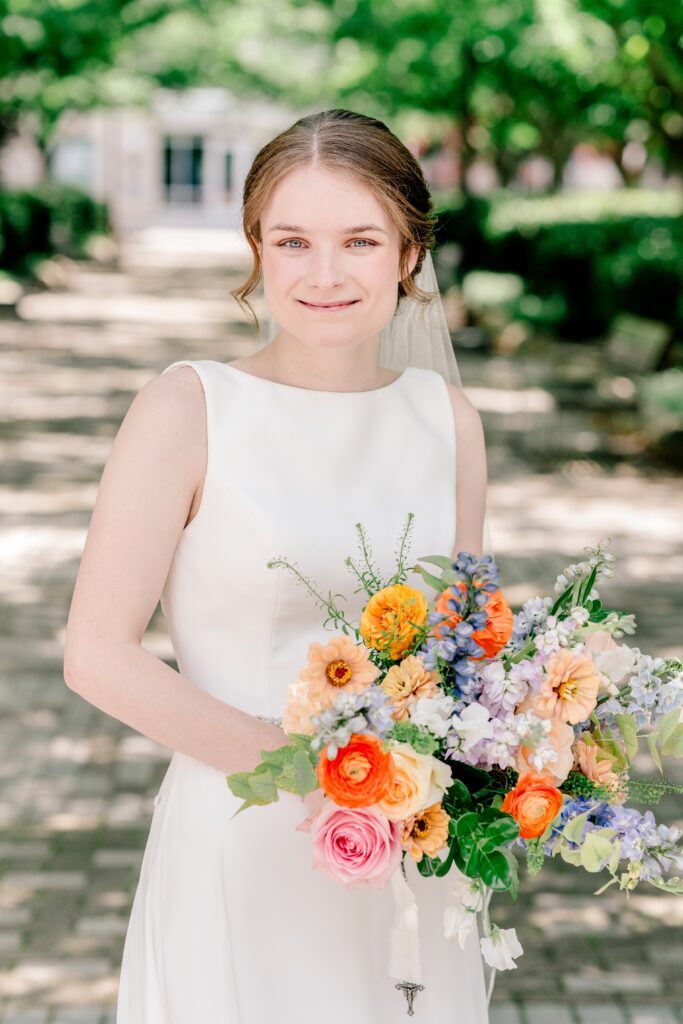 A bride smiles for a classic portrait before her Sheraton Reston wedding