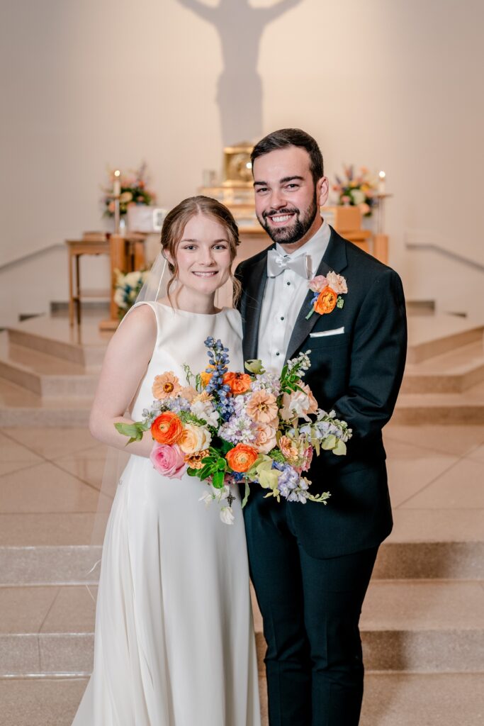 A classic portrait of the bride and groom after a wedding at St. Joseph Catholic Church in Herndon, Virginia