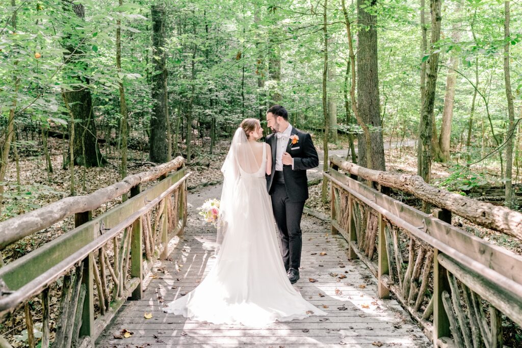 A bride and groom pose for an elegant portrait before their Sheraton Reston wedding reception