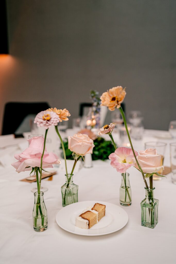 An arrangement of flowers and cake during a Sheraton Reston wedding reception