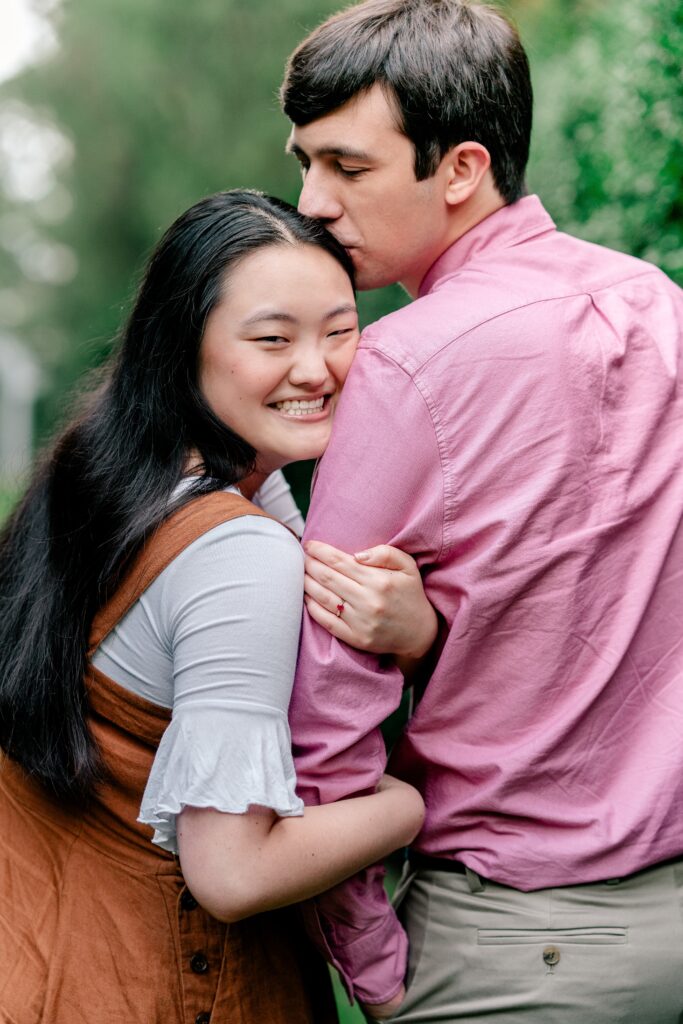 A couple posing for their fall engagement session at Oatlands Historic House and Gardens