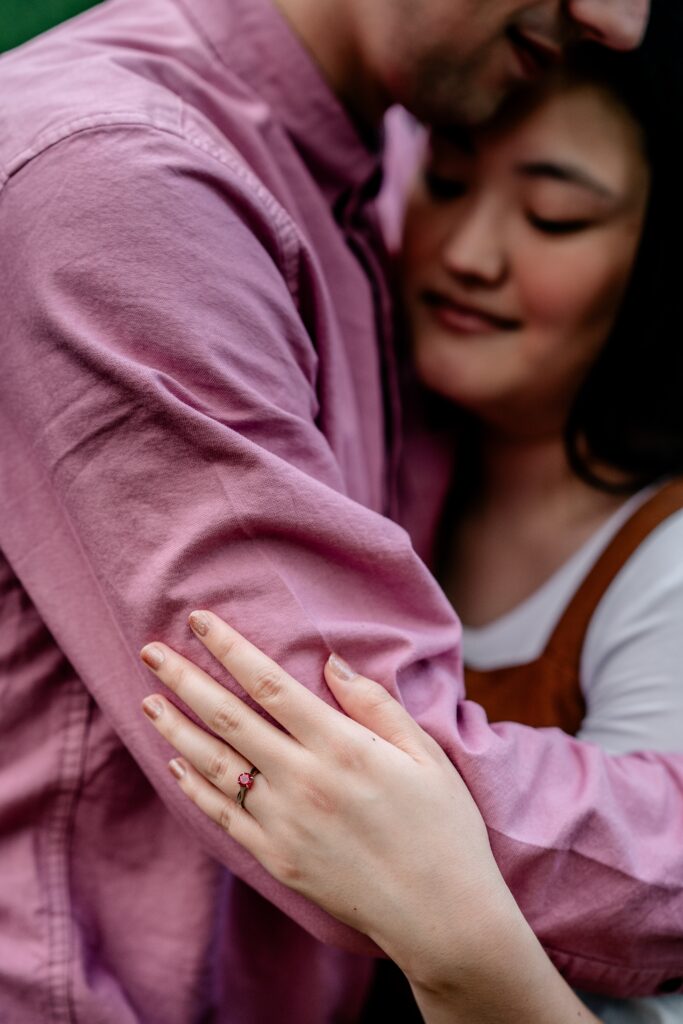 A couple posing for their fall engagement session at Oatlands Historic House and Gardens