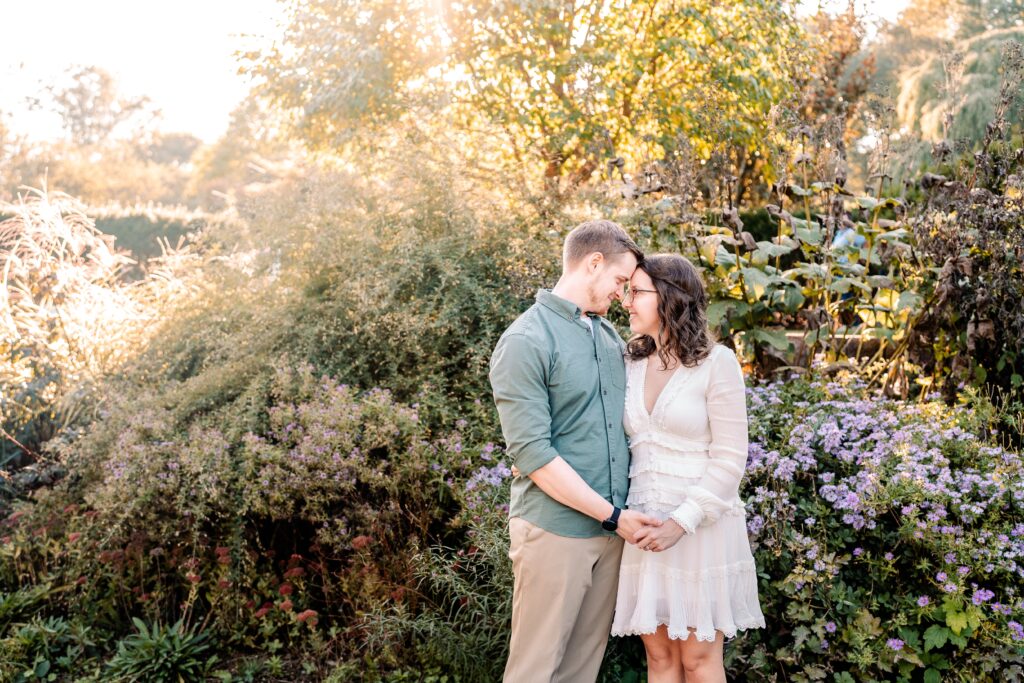 A couple holding hands during their Brookside Gardens engagement session in Silver Spring, MD