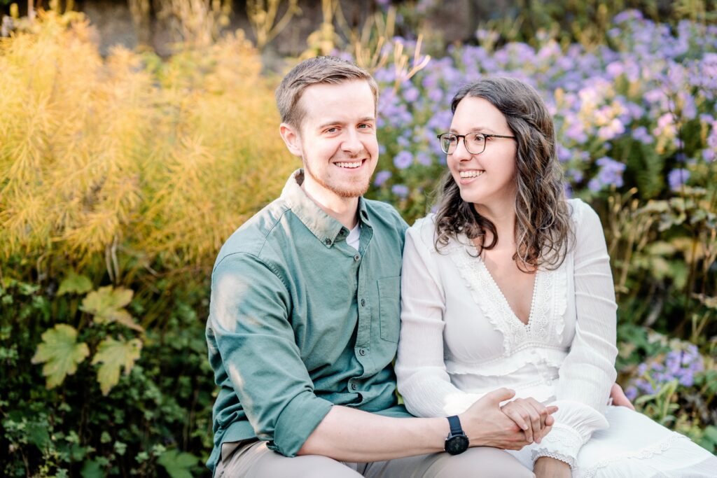 An engaged couple in a candid moment laughing together