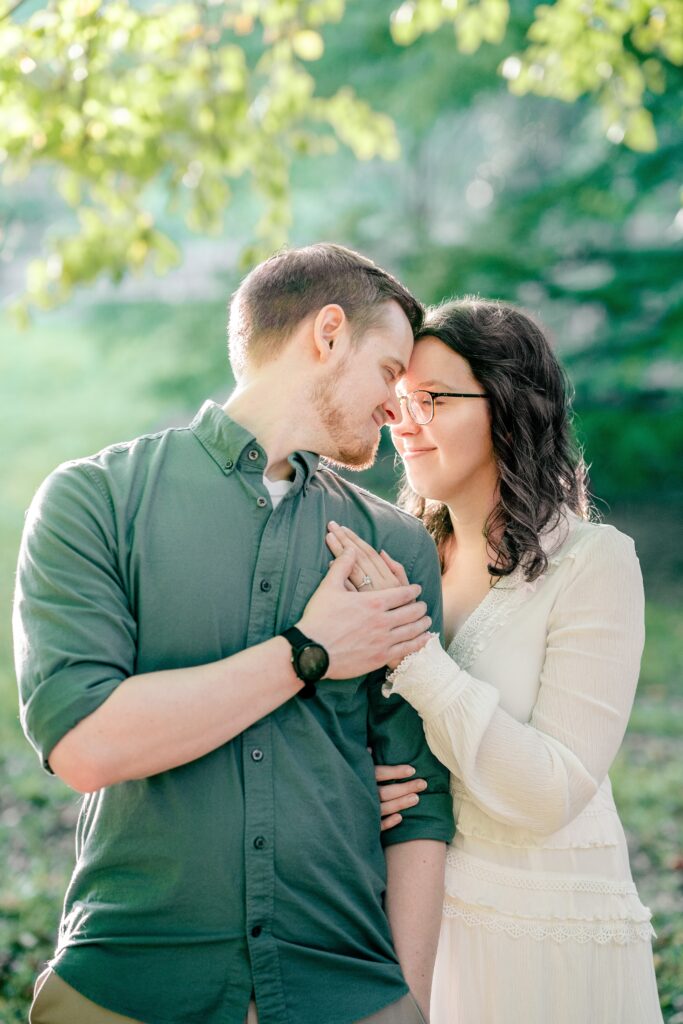 A couple sharing an intimate moment during their Brookside Gardens engagement session in Silver Spring, MD