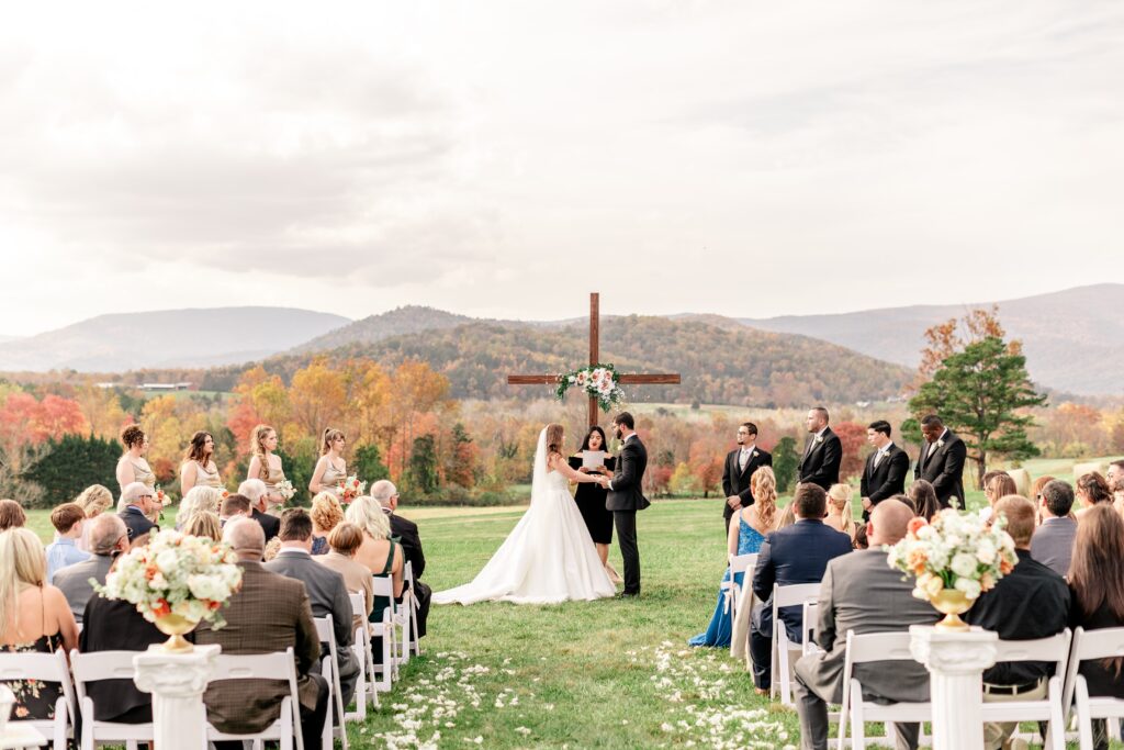 A wedding ceremony during a fall wedding at The Barn at Edgewood