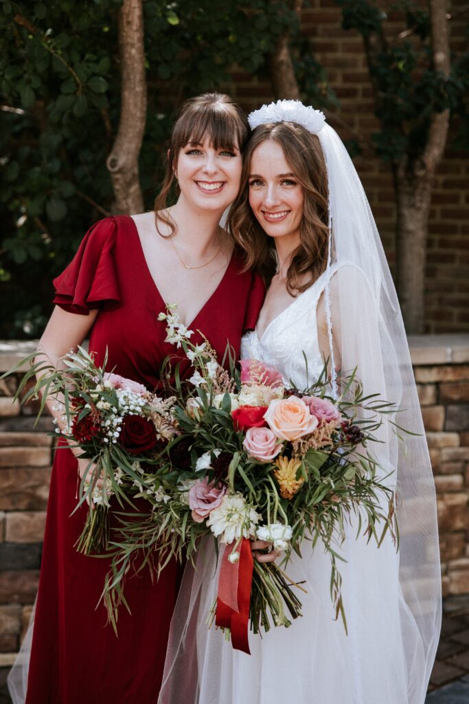 A bride and bridesmaids posing for a classic portrait during a Catholic wedding in Fredericksburg Virginia