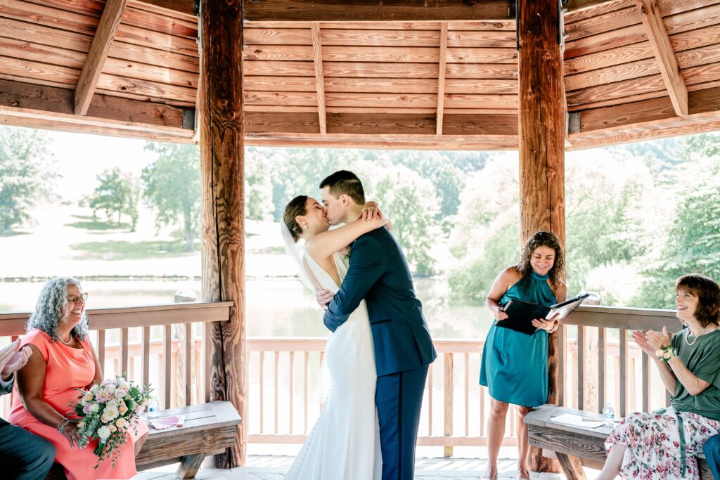 The first kiss as husband and wife during a micro wedding at Meadowlark Botanical Gardens