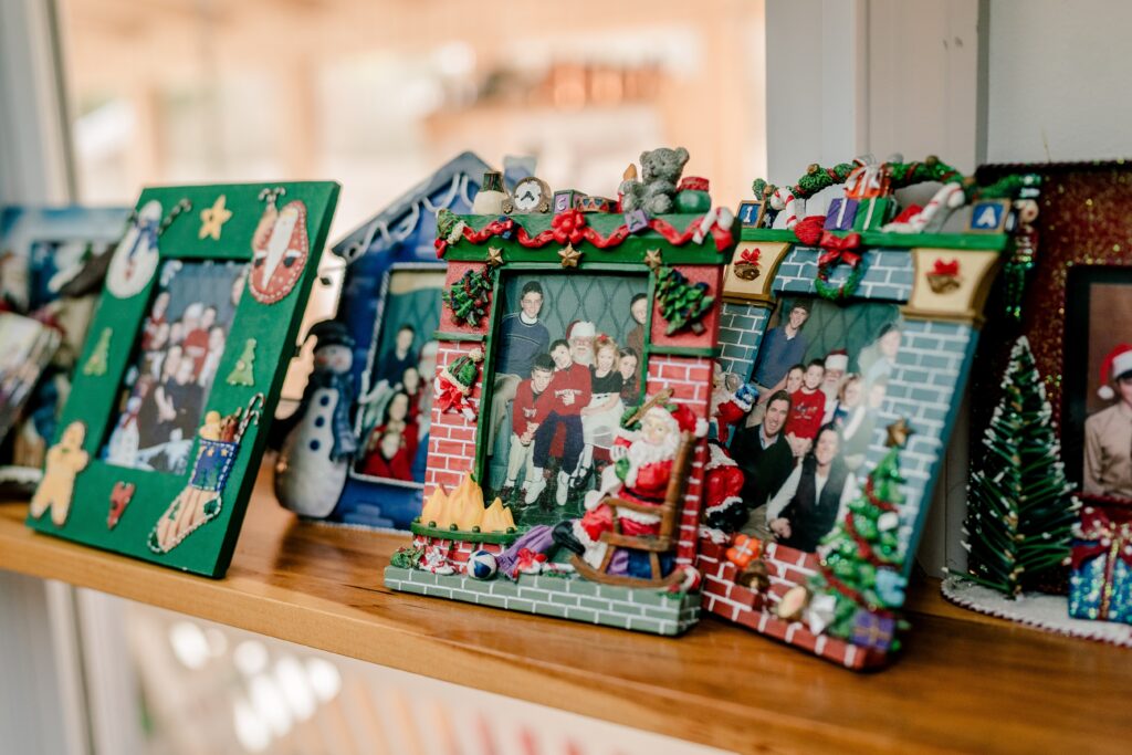 Decorations of family photos during a Christmas themed wedding