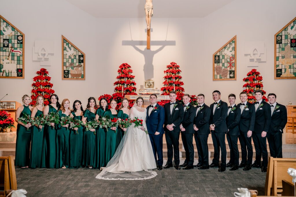 A wedding party posed for a wedding at St. Joseph Catholic Church in Herndon Virginia