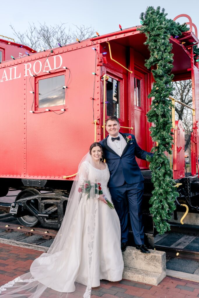 A bride and groom smile for a classic portrait during a Christmas themed wedding in Herndon Virginia