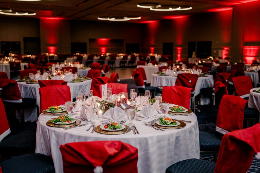 A reception with red decorations during a Christmas themed wedding at the Hyatt Regency Dulles in Herndon Virginia