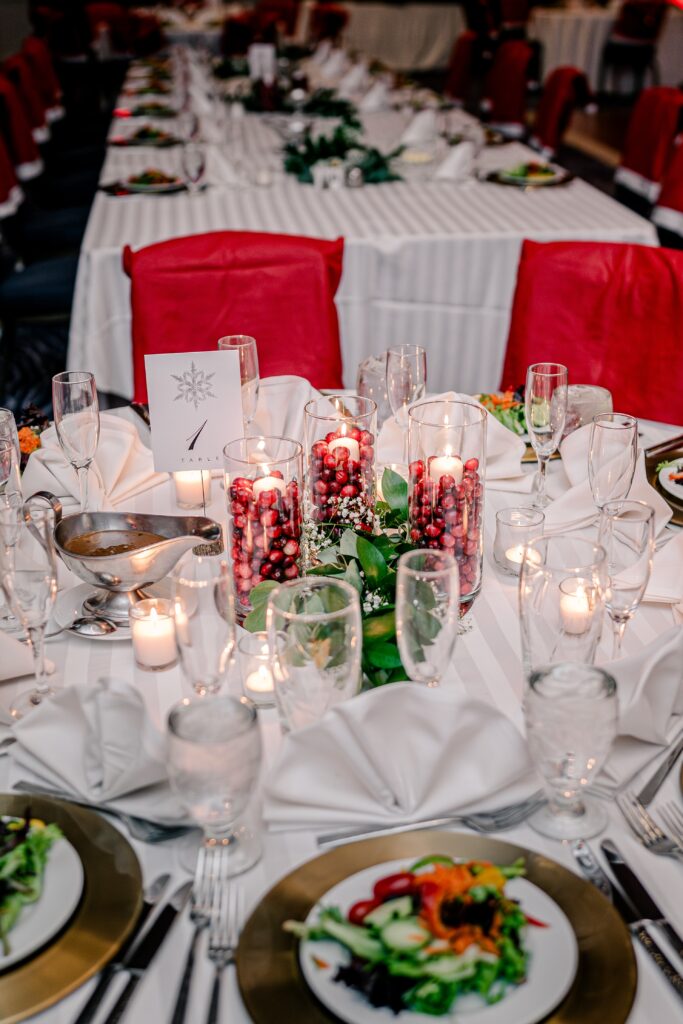 A table centerpiece featuring cranberries during a Christmas themed wedding at the Hyatt Regency Dulles in Herndon Virginia