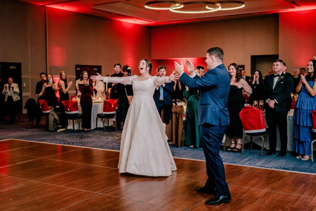 A bride and groom make a dramatic entrance to their wedding reception at the Hyatt Regency Dulles in Herndon VA