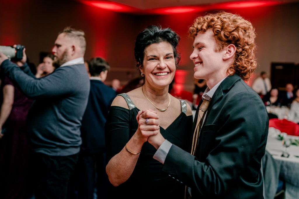 Wedding guests dancing together during a reception at the Hyatt Regency Dulles in Herndon VA