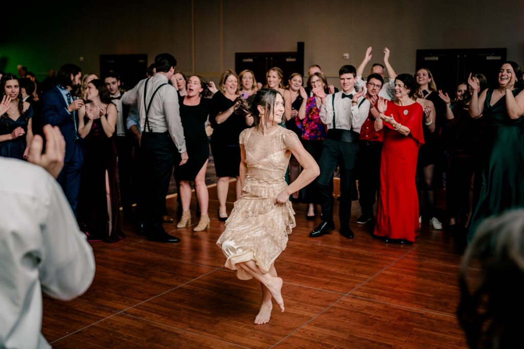 A wedding guest dancing