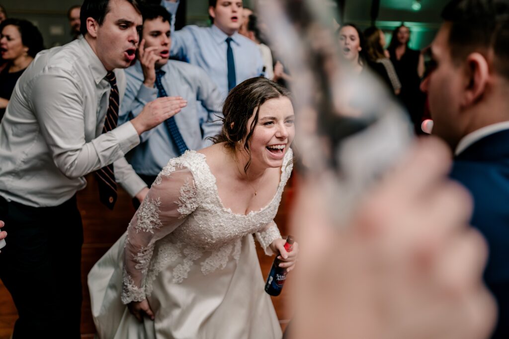 A bride dancing with guests during a Christmas themed wedding at the Hyatt Regency Dulles in Herndon Virginia