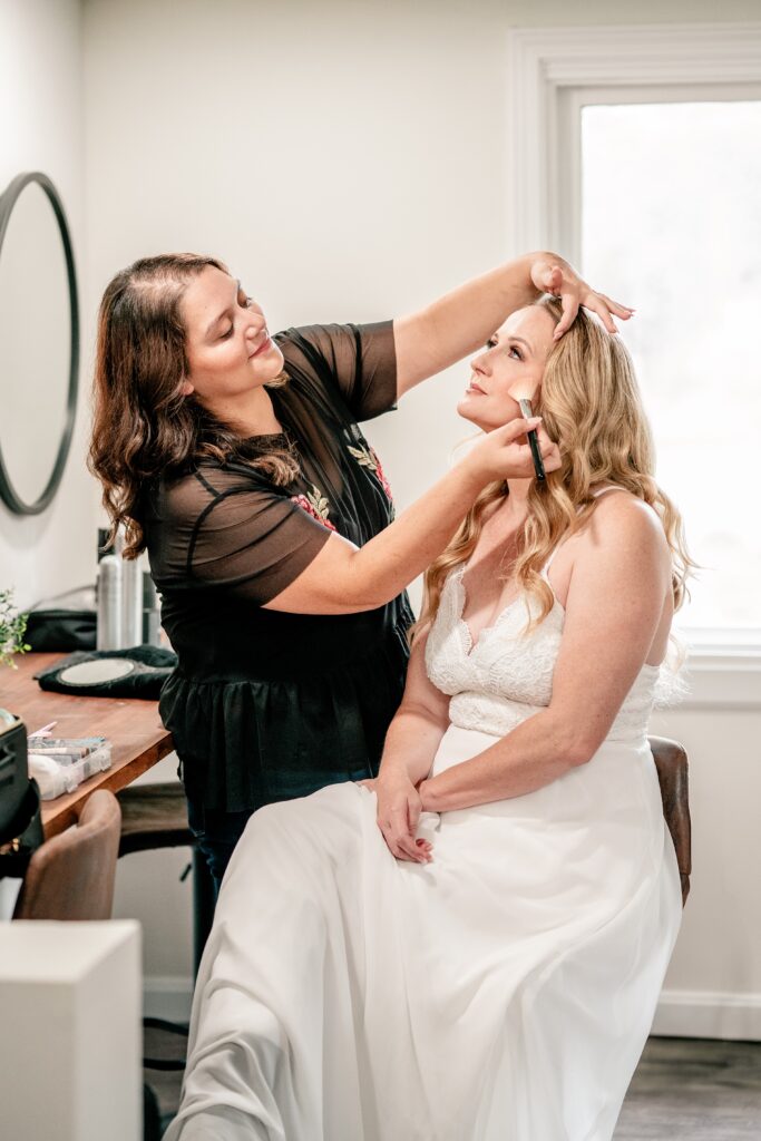 Sandra Makeup Artistry applying makeup to a bride