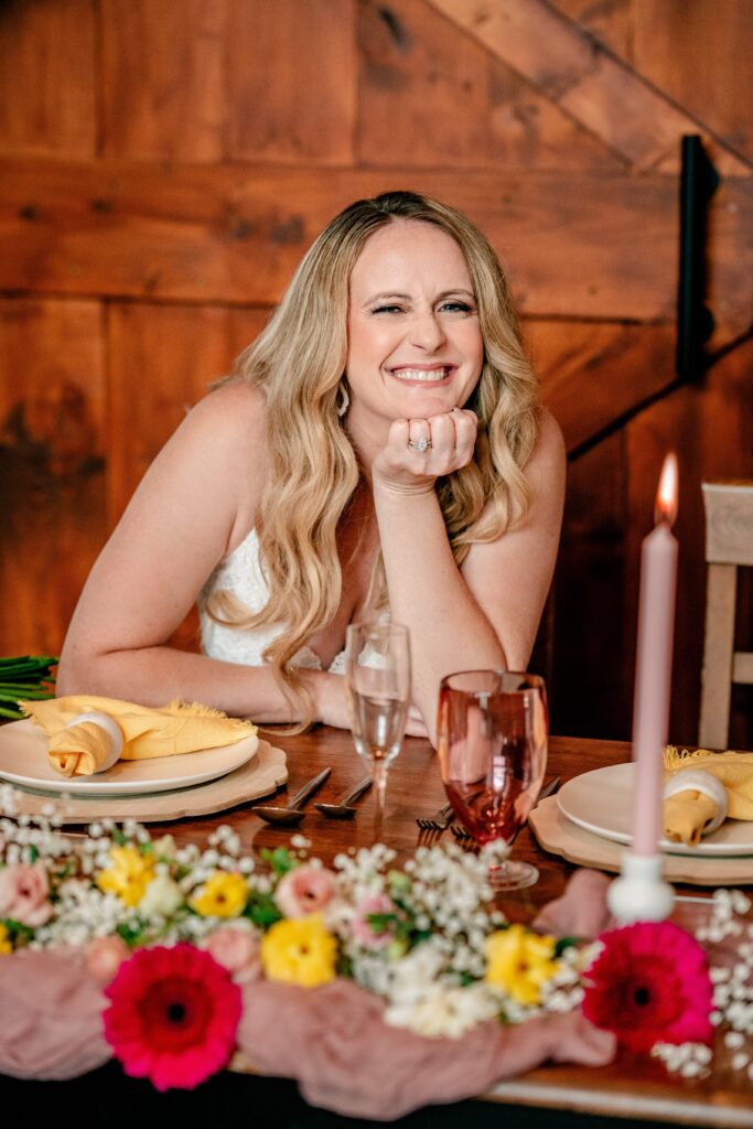 A smiling bride for a reception at Halcyon Watson, a modern barn wedding venue in Leesburg Virginia