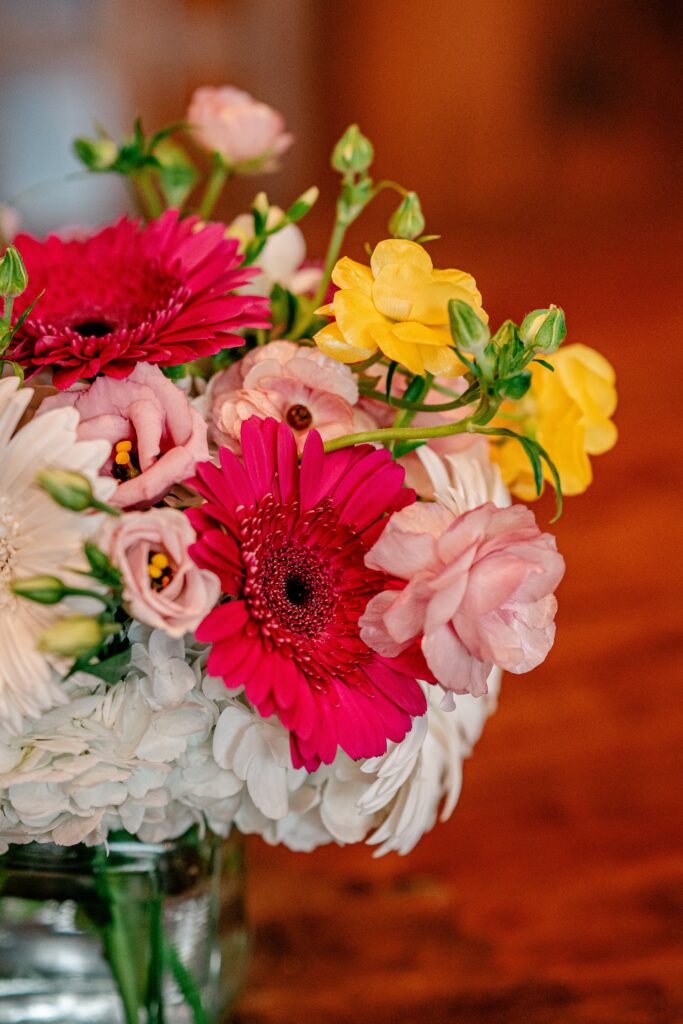 A close up of pink and yellow flowers