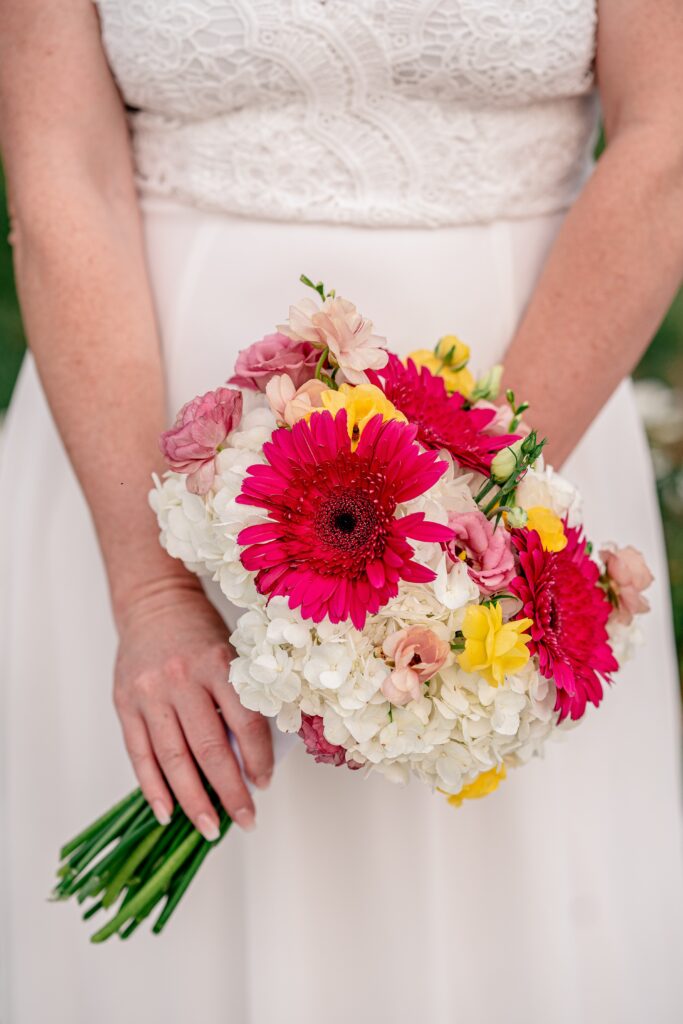 A vibrant pink and yellow bouquet by Mystical Rose Flowers in Fairfax VA