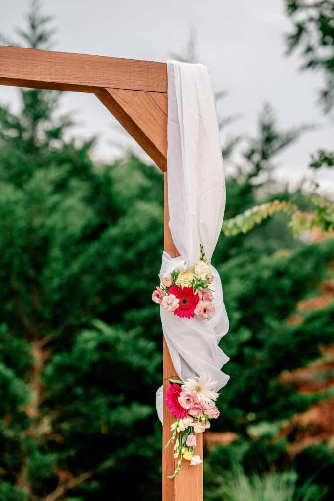 A ceremony arch at Halcyon Watson, a modern barn wedding venue in Leesburg Virginia