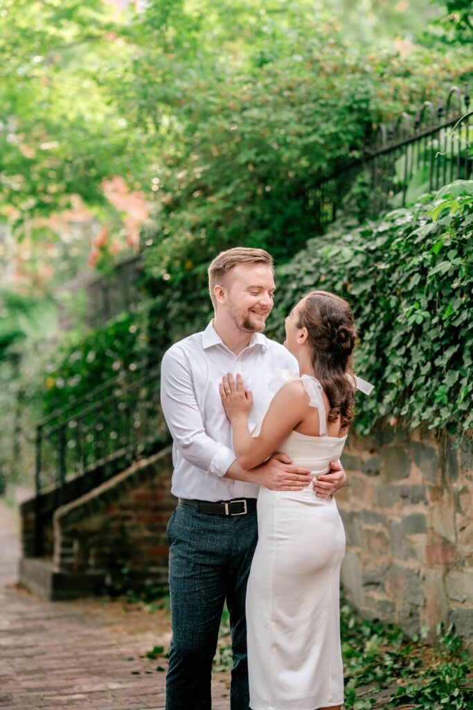 A couple gazes lovingly at one another in a photo by DC wedding photographer Beauty of the Soul Studio