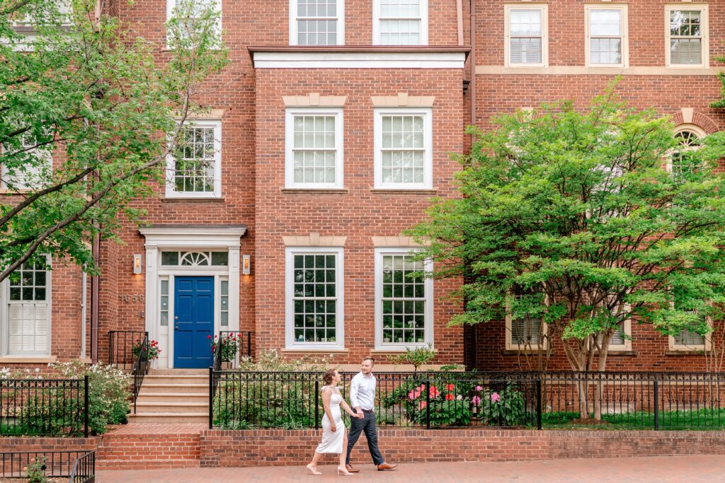 A couple walks together hand in hand in a photo by DC wedding photographer Beauty of the Soul Studio