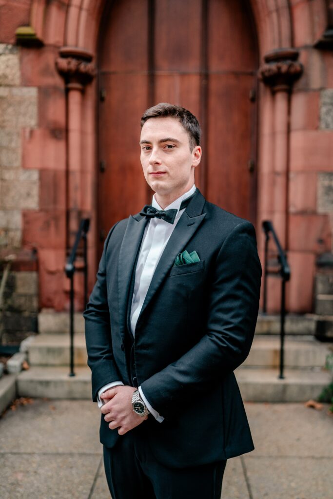 A groom takes a serious portrait by Northern Virginia wedding photographer Beauty of the Soul Studio